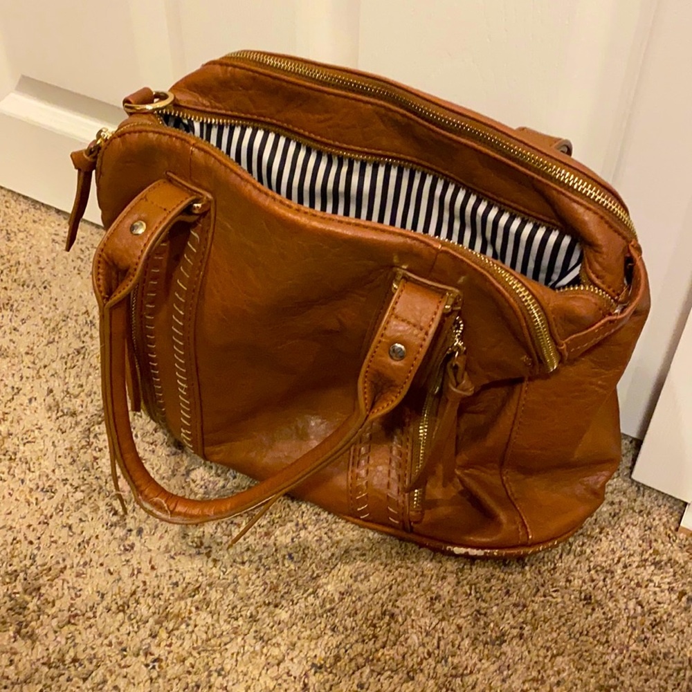 A tan leather purse